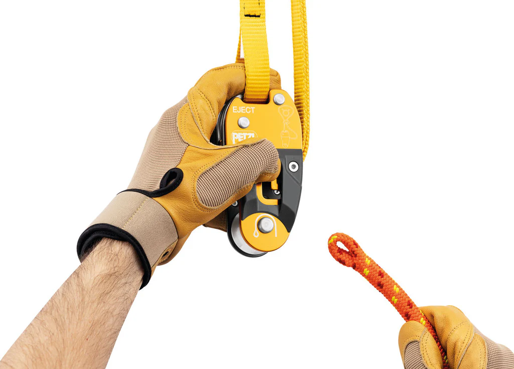 Detailed image of the PETZL EJECT Adjustable Friction Saver in use, showing its secure configuration on a tree branch for safe and efficient climbing. Ensure your gear meets the highest standards—call Endor's Arborist & Rope Supply at (234) 410-3240 to get expert help and premium equipment today.