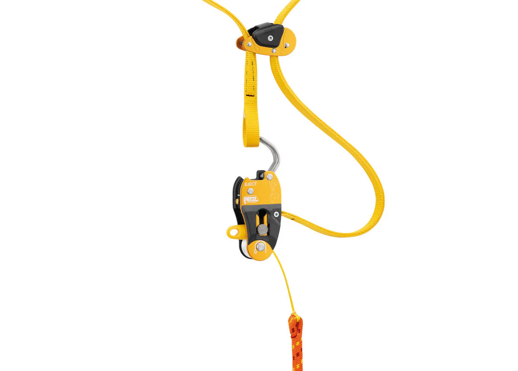 Close-up view of the PETZL EJECT Adjustable Friction Saver system secured to a tree limb, showcasing its durable construction and streamlined design. Stay safe and efficient on every climb—contact Endor's Arborist & Rope Supply at (234) 410-3240 for expert gear and support.